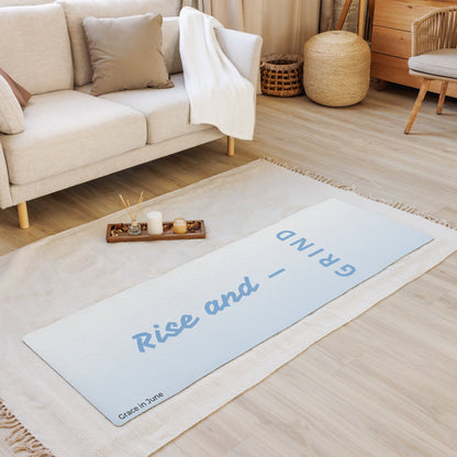 Light blue gradient premium yoga mat with Rise and Grind text